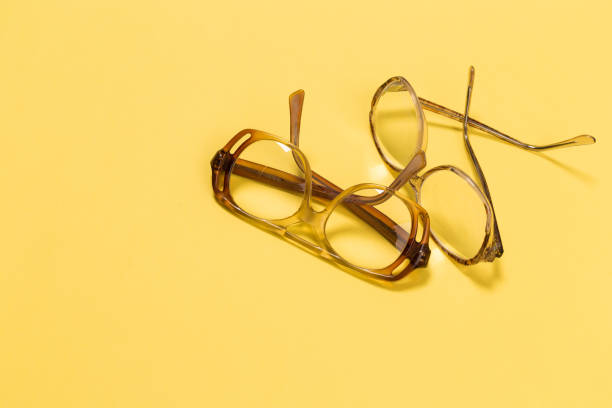 istock The combination of old glasses on yellow 1131374149