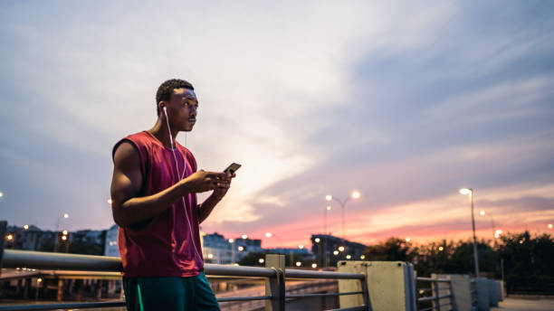 istock Male athlete texting after jogging exercise 1131374851