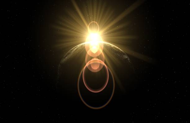 istock lens flare, sun behind the moon 1131375010