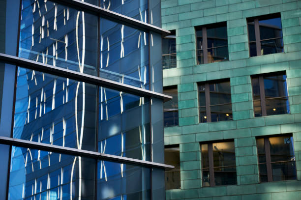 istock Windows of two office buildings with reflections 1131377124