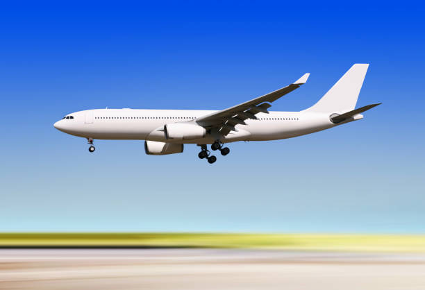 istock plane landing over runway of airport 1131377232