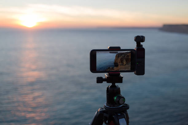 istock Tripod-mounted camera at Algarve, Portugal 1131380615