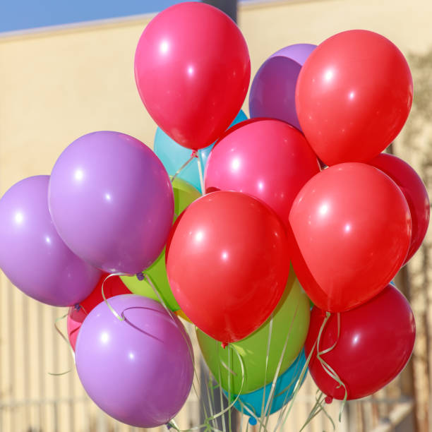istock Closeup of a group multicolored balloons 1131381694