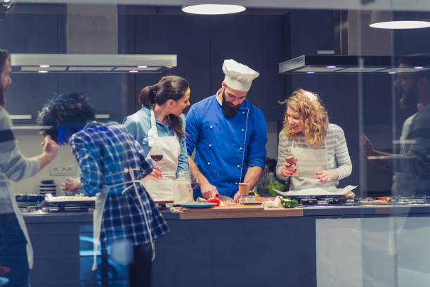 istock Chef is supervising attendees of cooking class 1131385578