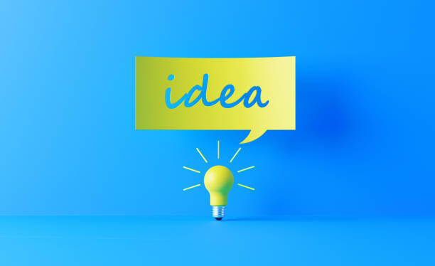 Light bulb and yellow speech bubble on blue background. Idea writes on the speech bubble. Horizontal composition with copy space. Creativity and innovation concept.
