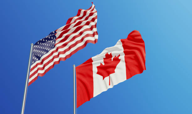 istock American and Canadian Flags Waving With Wind 1131386108