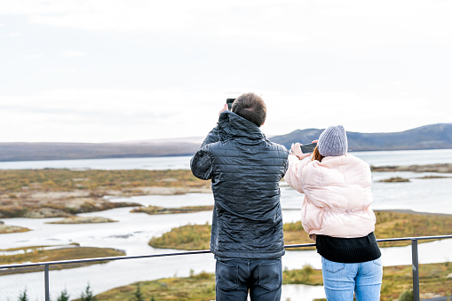 Thingvellir, Iceland - September 20, 2018: National Park during cold autumn day in Iceland Golden circle and people taking pictures of landscape