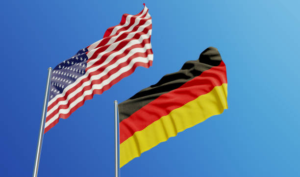 istock American and German Flags Waving With Wind 1131386326