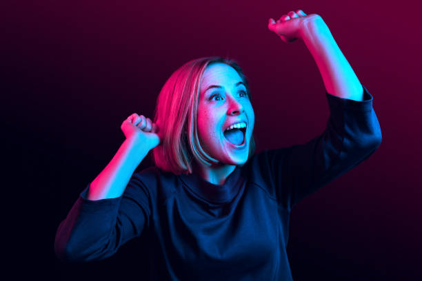 Winning success woman happy ecstatic celebrating being a winner. Dynamic energetic image of female model