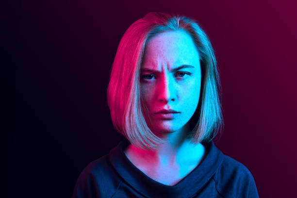 istock Beautiful woman looking bewildered isolated on neon 1131389008