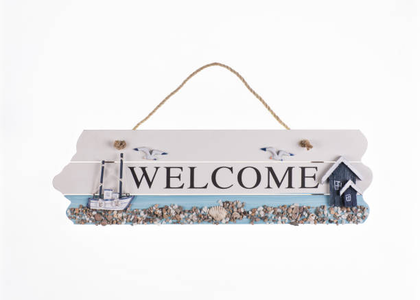 istock sea wooden signboard welcome on white background 1131389486