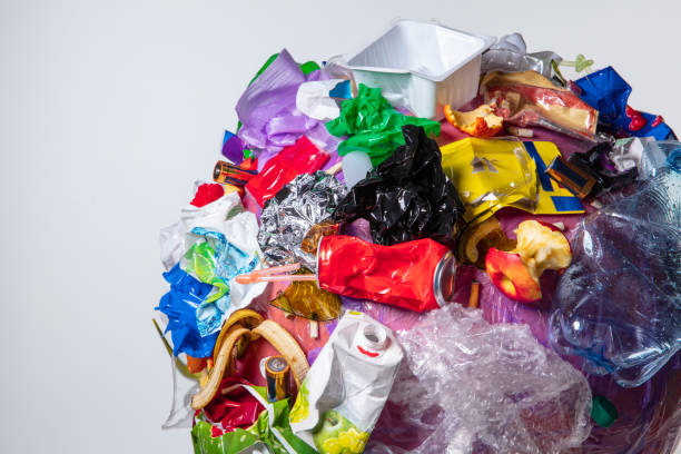 istock A globe of the earth with trash over white background, the concept of ecology problem 1131389687