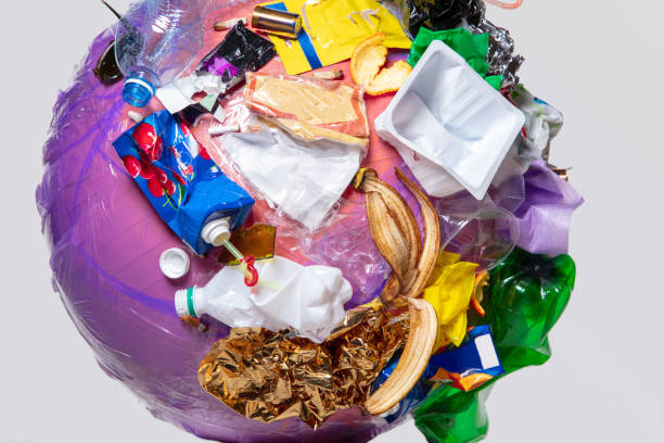 istock A globe of the earth with trash over white background, the concept of ecology problem 1131389708