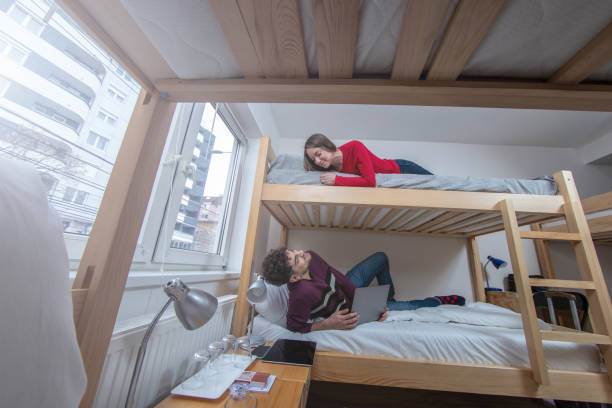Two friends spending time and relaxing in the hostel