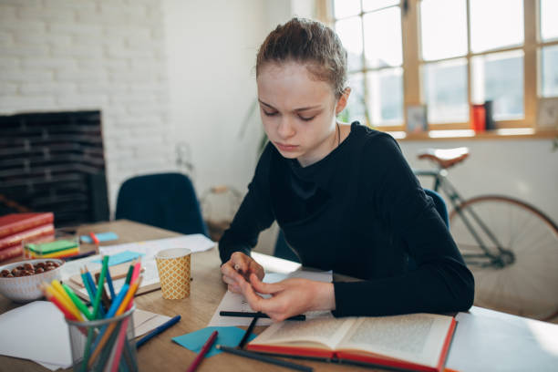 istock Cute girl student studying on class in private school 1131391288