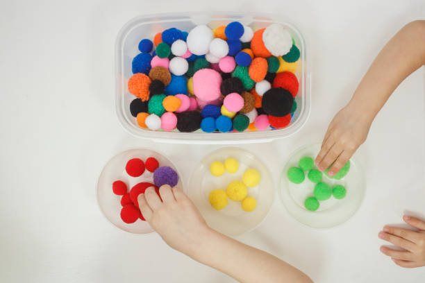 istock Toddlers playing multicolored educational games, mosaic and puzzles table 1131395500