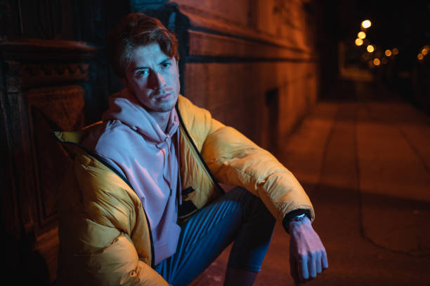 istock Sad looking hipster sitting outdoors 1131395558