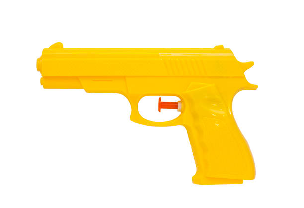 plastic spray gun, yellow, white background - toy gun imagens e fotografias de stock