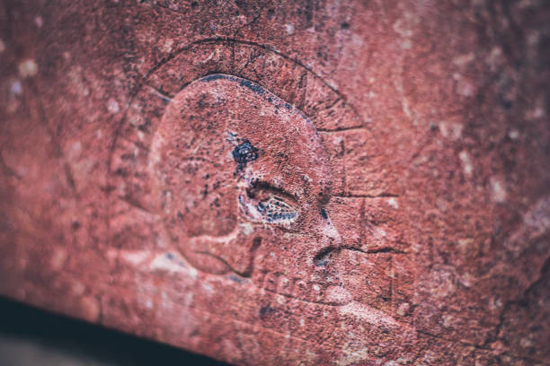istock Carved skull image on aged stone 1131397558