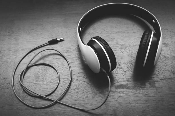 istock Close up headphone on brown wooden background. Top view 1131398576