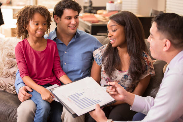 istock Multi-ethnic couple meets with financial advisor. 1131399122