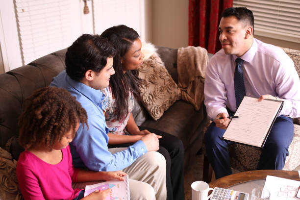 istock Multi-ethnic couple meets with financial advisor. 1131399175