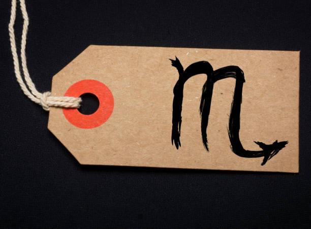 Zodiac sign painted on brown label painted sign and label photograph by contributor