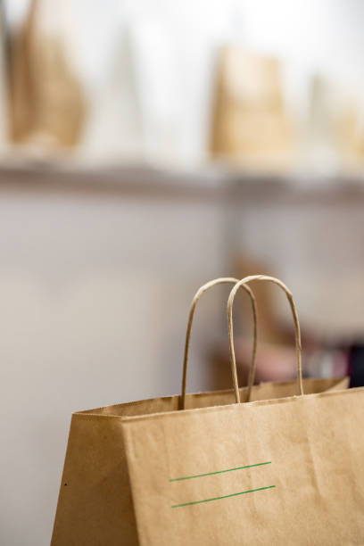 istock disposable bag of kraft paper on a blurred background. 1131401771