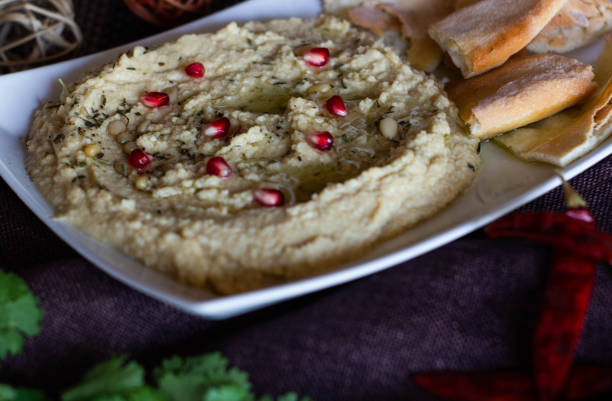 istock Classic hummus with parsley on the plate and pita bread 1131403037
