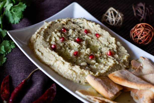 istock Classic hummus with parsley on the plate and pita bread 1131403050