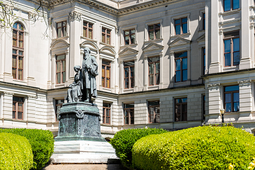 Moscow, Russia - April 08, 2023:  Pushkin Library with bust of the poet and writer at the entrance.