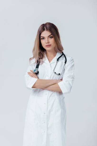 istock doctor woman in white coat with stethoscope 1131404108