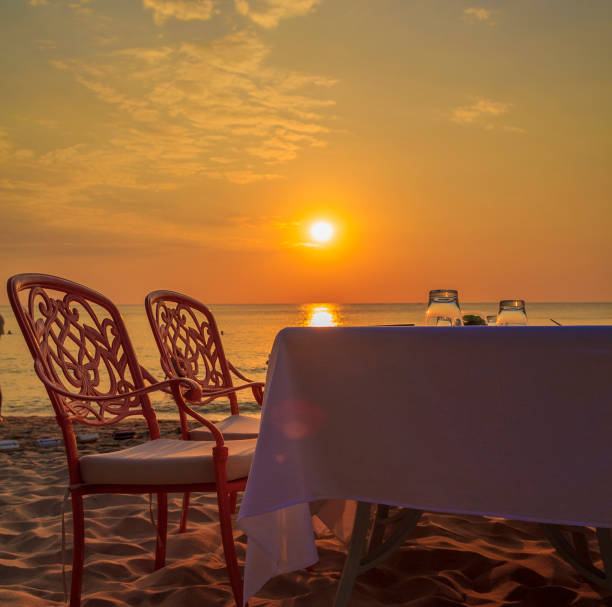 istock Romantic Beach Dinner during Sunset. Horizon in the Middle. 1131404479