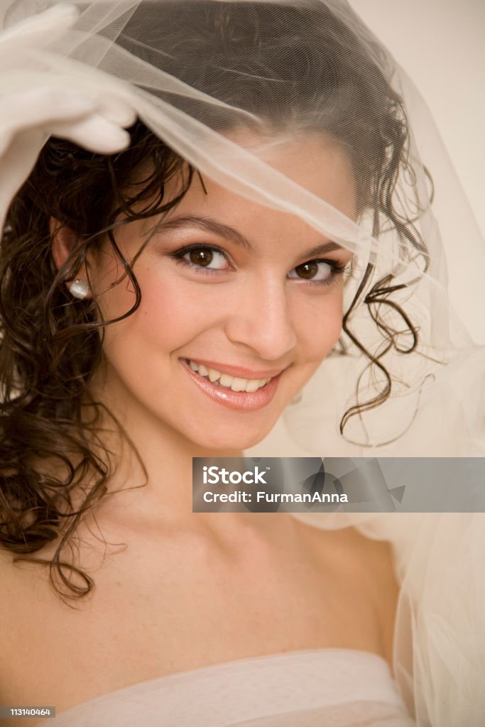 Young bride with the veil Young smiling bride holding a veil XL Adult Stock Photo