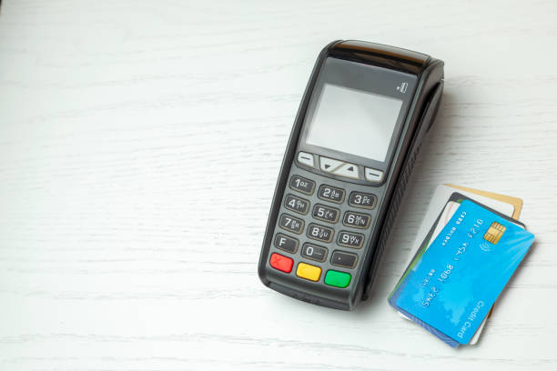 istock POS terminal, Payment Machine with credit card isolated on white background. Contactless payment with NFC technology. 1131408505