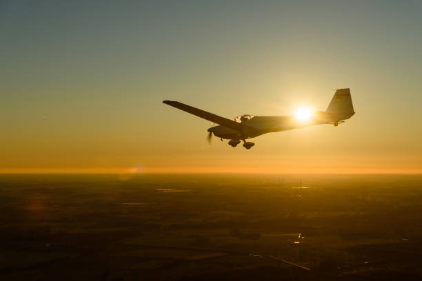 istock Motor glider in flight in the evening light 1131409647
