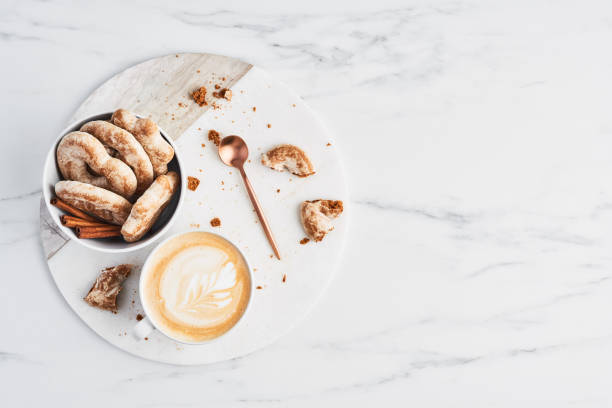 Coffee or cappuccino with latte art and gingerbread biscuits. Breakfast concept.