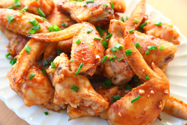 istock Chicken wings with scallions 1131410569