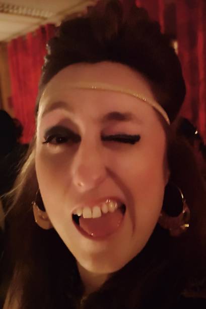 istock woman making silly faces with a lot of make-up 1131413279