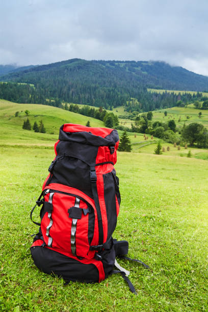 istock Travel backpack on the mountain  landscape view background. 1131414632