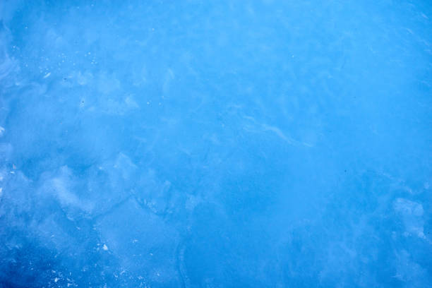 texture blue cosmic ice with a matte effect on a lake in the - icicle ice textured arctic imagens e fotografias de stock