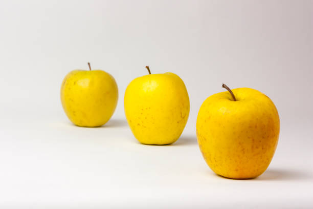 istock Yellow apples isolated on white background 1131418157