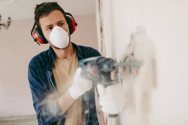 istock Man using drilling machine during reconstruction of his apartment 1131419582