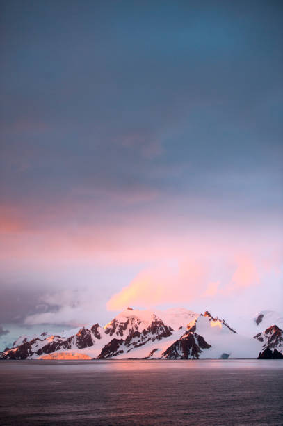 Golden sunset in Antarctica stock photo