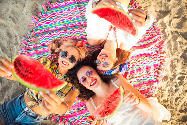 istock Female friends eating watermelon 1131420141