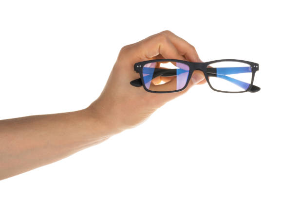 istock hand holding glasses isolated on white clipping path 1131420221