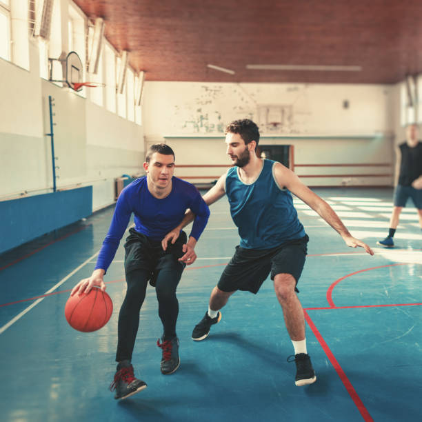 istock basketball players playing basketball 1131421804