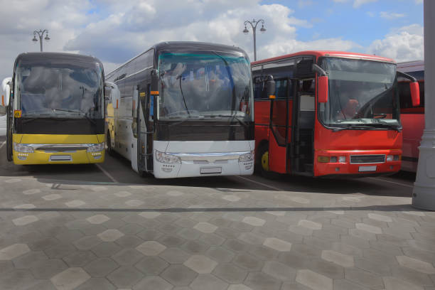 istock buses on parking on the background of cloudy sky 1131421902