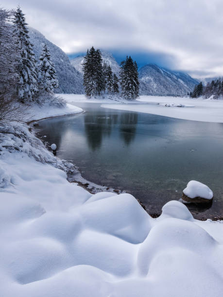 istock Winter by the Predil lake 1131425294
