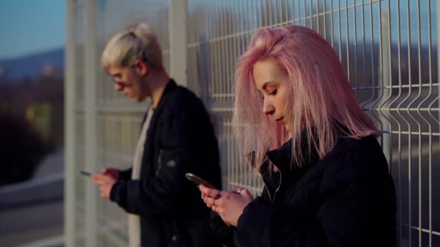 Teens occupied with smart phones